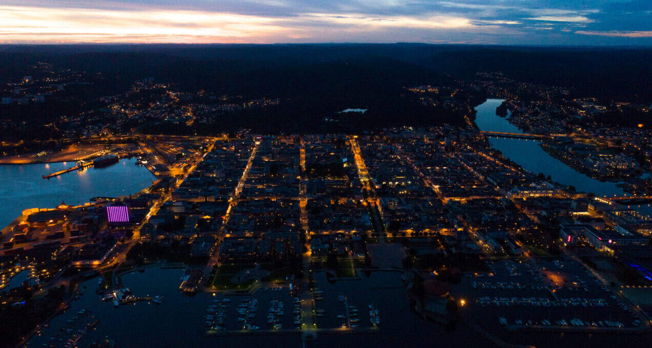 A birds eye view of a city lit up at night